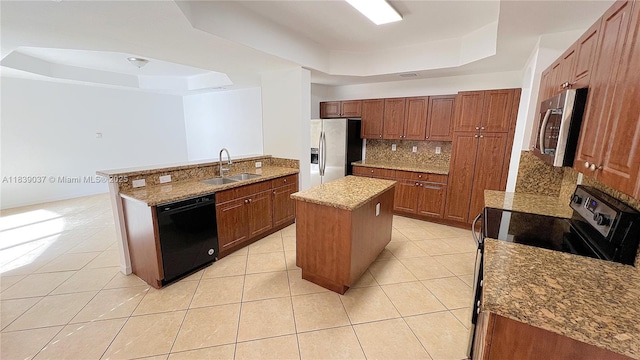 3001 SW 156th Ave, Miami, FL 33185 - kitchen featuring appliances with stainless steel finishes, a raised ceiling, decorative backsplash, and a center island