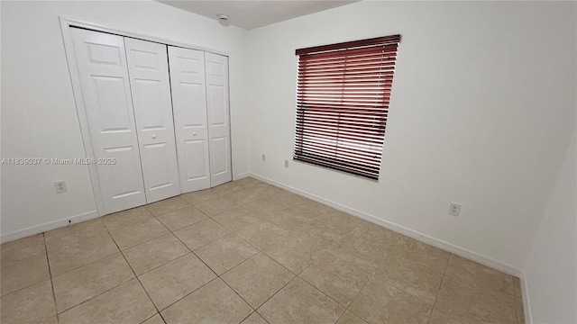 3001 SW 156th Ave, Miami, FL 33185 - unfurnished bedroom with light tile patterned floors and a closet