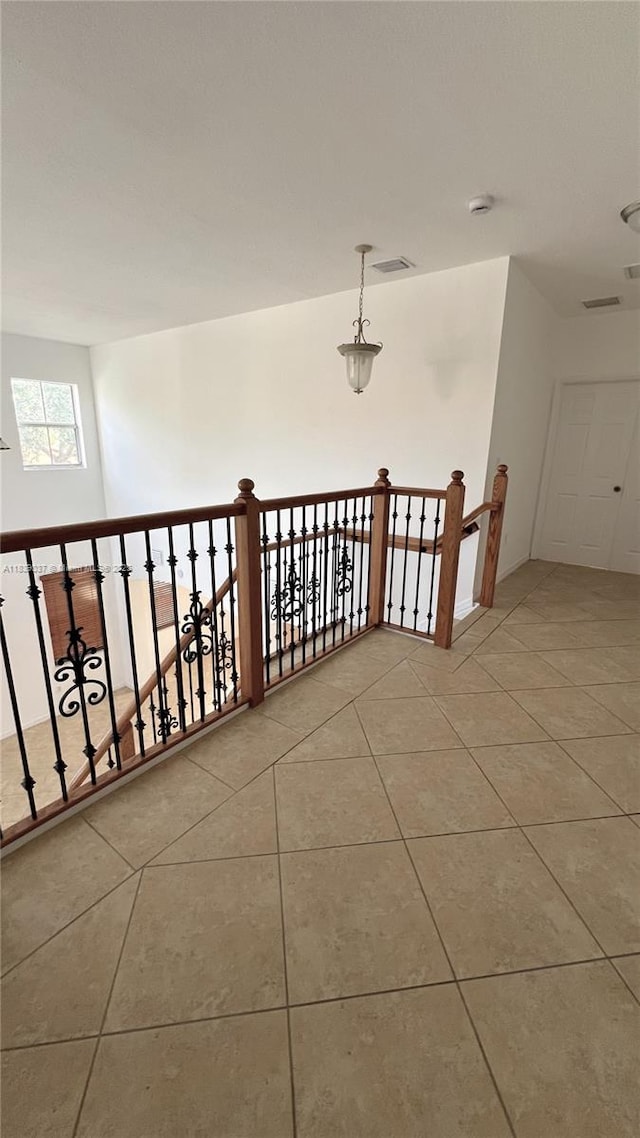 3001 SW 156th Ave, Miami, FL 33185 - hallway with light tile patterned floors and an upstairs landing