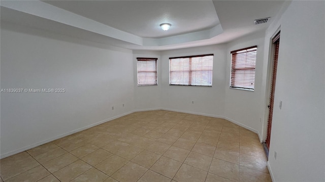 3001 SW 156th Ave, Miami, FL 33185 - empty room with a tray ceiling, plenty of natural light, and light tile patterned floors