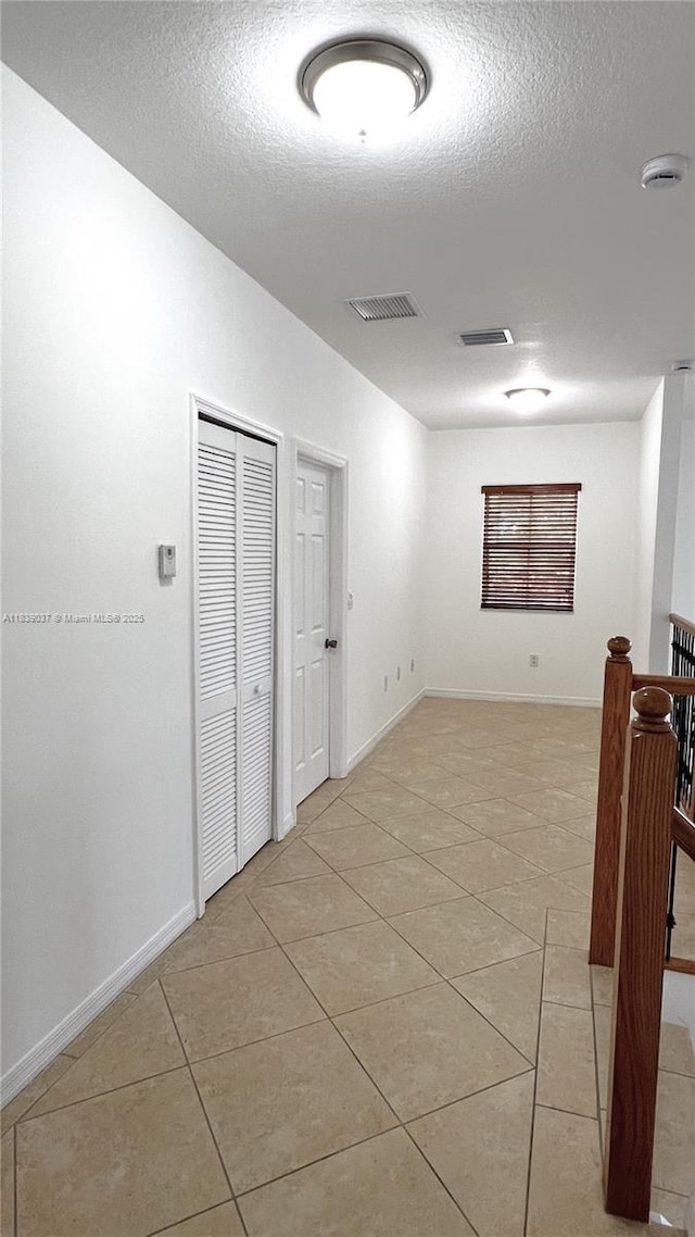 3001 SW 156th Ave, Miami, FL 33185 - empty room featuring light tile patterned floors, a textured ceiling, and a smoke detector