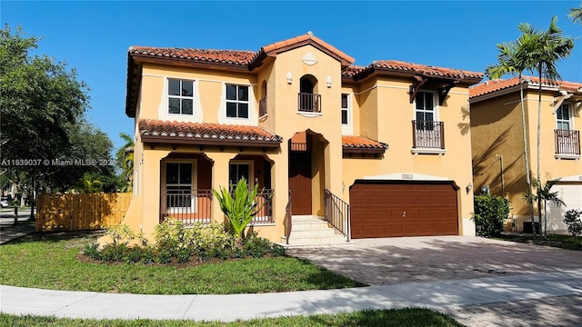3001 SW 156th Ave, Miami, FL 33185 - mediterranean / spanish house featuring a tiled roof, stucco siding, an attached garage, and driveway