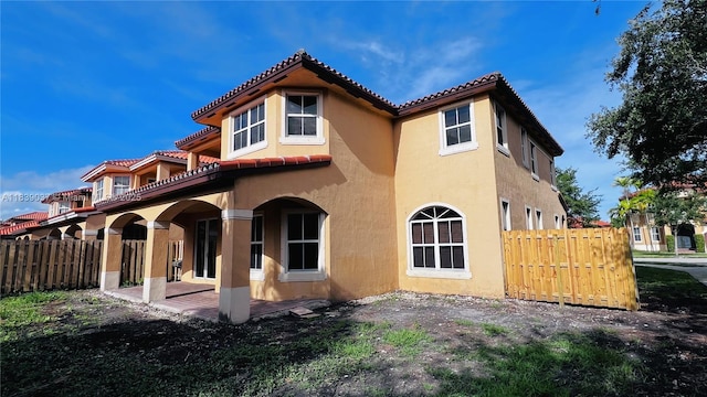 3001 SW 156th Ave, Miami, FL 33185 - back of property featuring stucco siding, a tiled roof, and a patio area