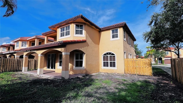 3001 SW 156th Ave, Miami, FL 33185 - back of property with stucco siding, a tile roof, and a patio