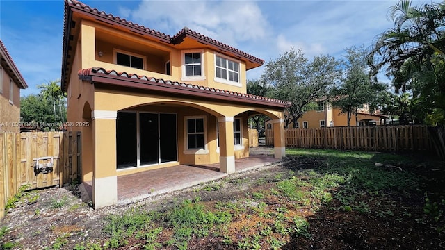 3001 SW 156th Ave, Miami, FL 33185 - back of house featuring stucco siding, a tile roof, a patio, and a fenced backyard