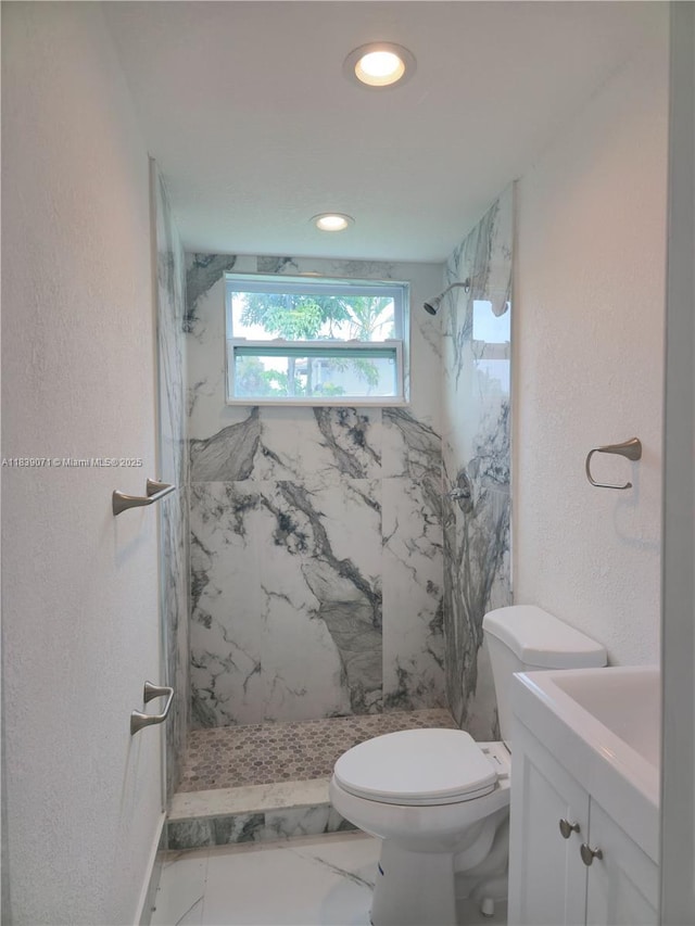 1141 SW 8th Ter, Fort Lauderdale, FL 33315 - bathroom featuring vanity, a marble finish shower, recessed lighting, marble finish flooring, and a textured wall