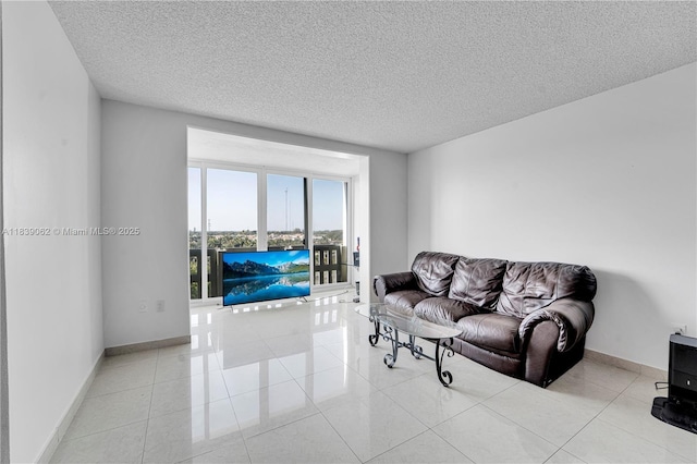 919 Hillcrest Dr Unit 704, Hollywood, FL 33021 - living area featuring a textured ceiling and light tile patterned flooring