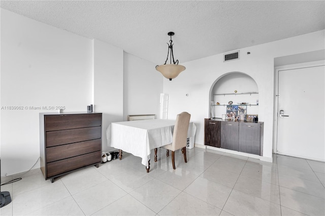 919 Hillcrest Dr Unit 704, Hollywood, FL 33021 - dining space featuring light tile patterned floors and a textured ceiling
