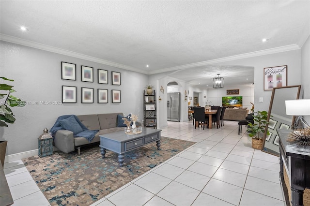 1650 SW 17th St, Miami, FL 33145 - living area featuring arched walkways, light tile patterned floors, crown molding, recessed lighting, and a textured ceiling