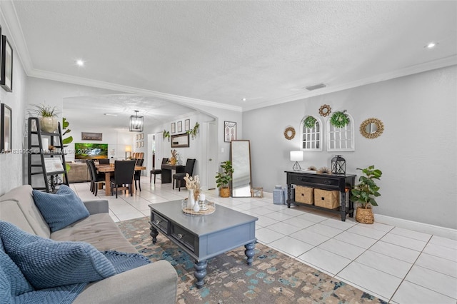 1650 SW 17th St, Miami, FL 33145 - living area featuring arched walkways, light tile patterned floors, a textured ceiling, recessed lighting, and ornamental molding