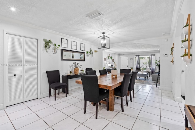1650 SW 17th St, Miami, FL 33145 - dining space featuring ornamental molding, a chandelier, light tile patterned flooring, and a textured ceiling