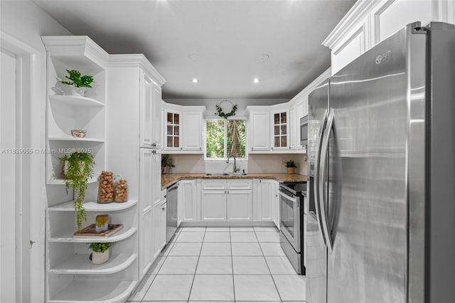 1650 SW 17th St, Miami, FL 33145 - kitchen featuring appliances with stainless steel finishes, open shelves, dark stone countertops, and recessed lighting
