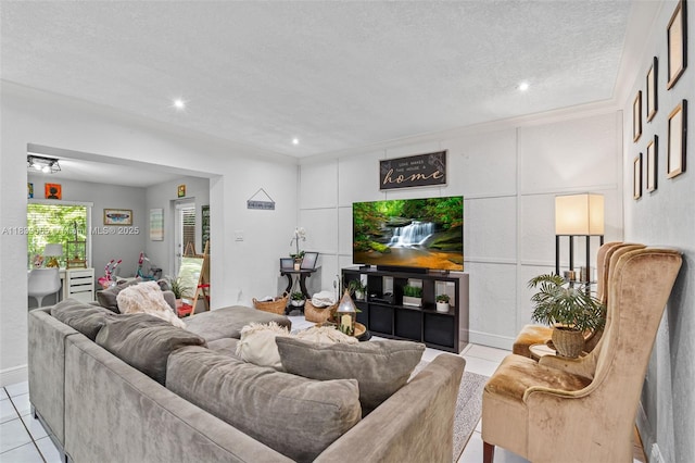 1650 SW 17th St, Miami, FL 33145 - living area featuring light tile patterned floors, a textured ceiling, and recessed lighting