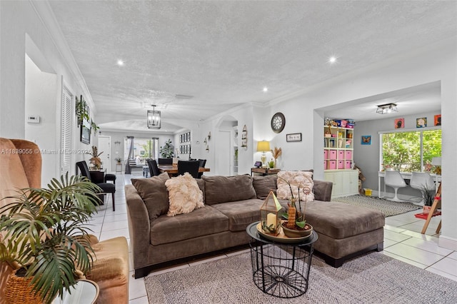 1650 SW 17th St, Miami, FL 33145 - tiled living room featuring a textured ceiling, recessed lighting, crown molding, and arched walkways