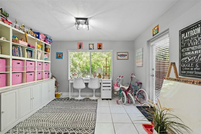 1650 SW 17th St, Miami, FL 33145 - office with healthy amount of natural light, light tile patterned flooring, and a textured ceiling