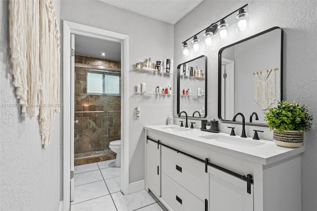 1650 SW 17th St, Miami, FL 33145 - bathroom with double vanity, a shower stall, and a textured wall