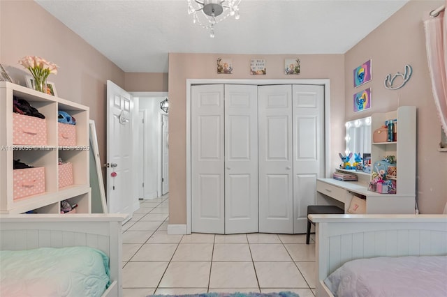 1650 SW 17th St, Miami, FL 33145 - bedroom featuring light tile patterned floors and a closet