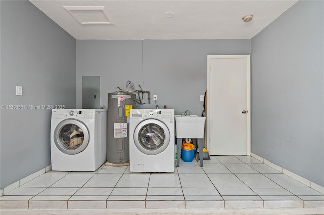 1650 SW 17th St, Miami, FL 33145 - washroom featuring electric water heater, electric panel, washer and dryer, tile patterned floors, and attic access