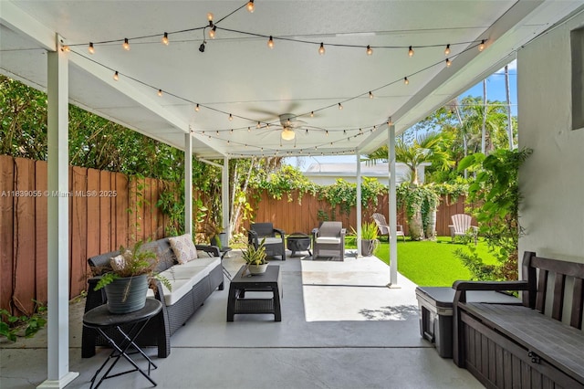 1650 SW 17th St, Miami, FL 33145 - fenced backyard featuring outdoor lounge area, a patio area, and a ceiling fan