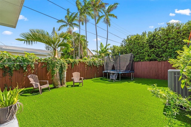 1650 SW 17th St, Miami, FL 33145 - fenced backyard featuring a trampoline