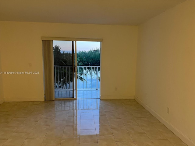 8200 SW 210th St Unit 308, Cutler Bay, FL 33189 - unfurnished room featuring baseboards and light tile patterned floors
