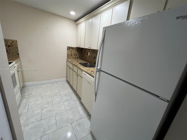 8200 SW 210th St Unit 308, Cutler Bay, FL 33189 - kitchen with white appliances, decorative backsplash, light stone countertops, recessed lighting, and white cabinets