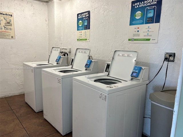 8200 SW 210th St Unit 308, Cutler Bay, FL 33189 - community laundry featuring washing machine and clothes dryer, tile patterned flooring, and a textured wall