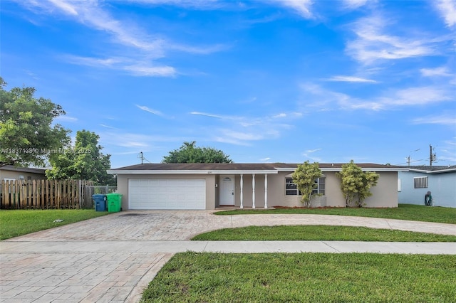 8390 NW 24th St, Sunrise, FL 33322 - ranch-style home with decorative driveway, stucco siding, and an attached garage