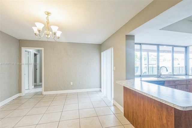 8390 NW 24th St, Sunrise, FL 33322 - unfurnished dining area with a chandelier, light tile patterned floors, and a textured wall
