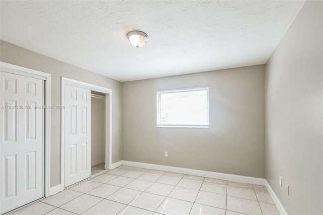 8390 NW 24th St, Sunrise, FL 33322 - unfurnished bedroom featuring light tile patterned floors and baseboards