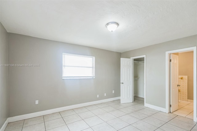 8390 NW 24th St, Sunrise, FL 33322 - unfurnished bedroom featuring light tile patterned flooring and ensuite bath