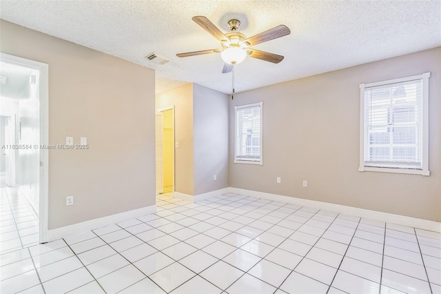 5370 SW 144th Ave, Miami, FL 33175 - empty room with a ceiling fan, a textured ceiling, and light tile patterned floors