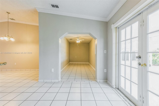 5370 SW 144th Ave, Miami, FL 33175 - spare room featuring arched walkways, crown molding, a ceiling fan, light tile patterned floors, and a chandelier