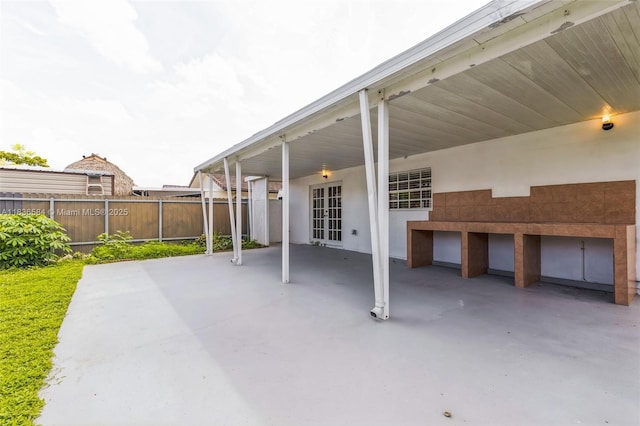 5370 SW 144th Ave, Miami, FL 33175 - view of patio / terrace featuring french doors