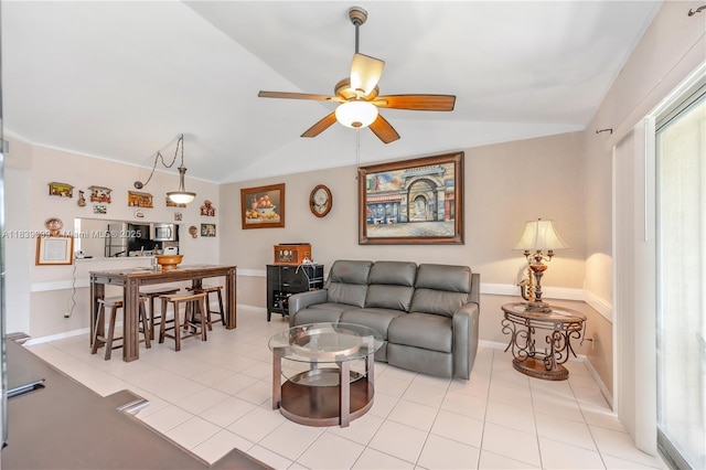 5560 Lakeside Dr Unit 204, Margate, FL 33063 - living room with lofted ceiling, a ceiling fan, and light tile patterned floors