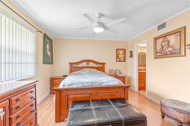 5560 Lakeside Dr Unit 204, Margate, FL 33063 - bedroom with light wood finished floors, crown molding, ensuite bath, and ceiling fan