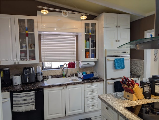 2606 Gulfstream Ln, Fort Lauderdale, FL 33312 - kitchen with dishwasher, decorative backsplash, white double oven, and white cabinets