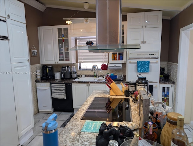 2606 Gulfstream Ln, Fort Lauderdale, FL 33312 - kitchen with black appliances, white cabinetry, light tile patterned flooring, crown molding, and glass insert cabinets
