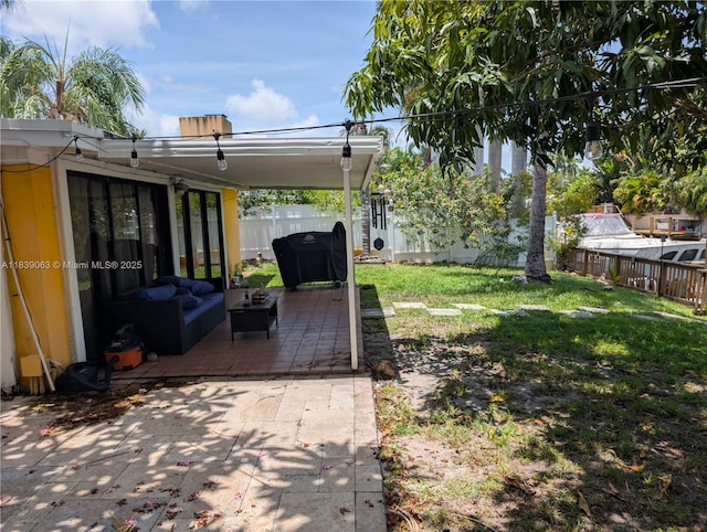 2606 Gulfstream Ln, Fort Lauderdale, FL 33312 - fenced backyard with a patio and an outdoor living space