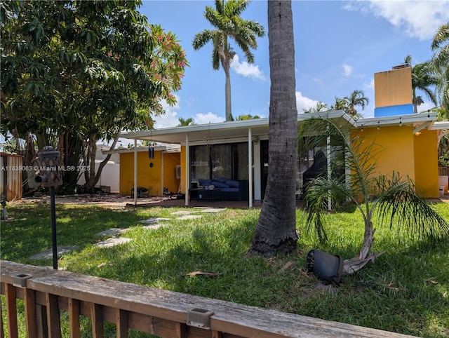 2606 Gulfstream Ln, Fort Lauderdale, FL 33312 - rear view of house with a yard