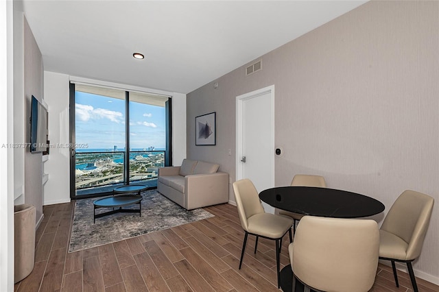398 NE 5th St Unit 3711, Miami, FL 33132 - dining area featuring a wall of windows and wood finished floors