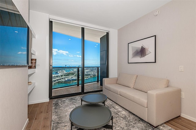 398 NE 5th St Unit 3711, Miami, FL 33132 - living area featuring floor to ceiling windows and wood finished floors
