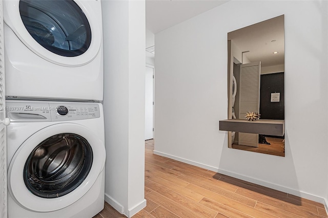 398 NE 5th St Unit 3711, Miami, FL 33132 - laundry area featuring stacked washer and clothes dryer and wood finished floors