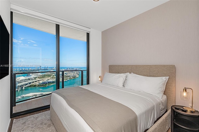 398 NE 5th St Unit 3711, Miami, FL 33132 - bedroom with floor to ceiling windows, a water view, and view of marina