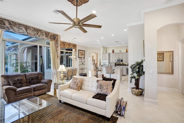 15595 Chandelle Pl, Wellington, FL 33414 - living area featuring arched walkways, crown molding, a ceiling fan, light tile patterned floors, and recessed lighting