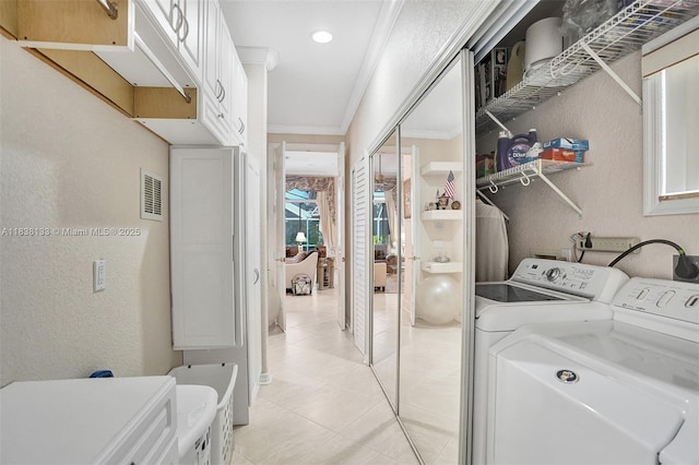 15595 Chandelle Pl, Wellington, FL 33414 - laundry room featuring washer and dryer, ornamental molding, light tile patterned floors, a textured wall, and recessed lighting