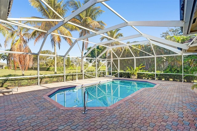 15595 Chandelle Pl, Wellington, FL 33414 - outdoor pool with a patio area and glass enclosure