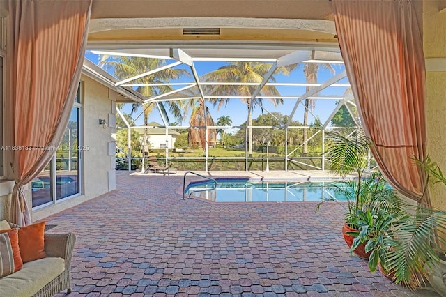 15595 Chandelle Pl, Wellington, FL 33414 - swimming pool featuring a patio area and glass enclosure