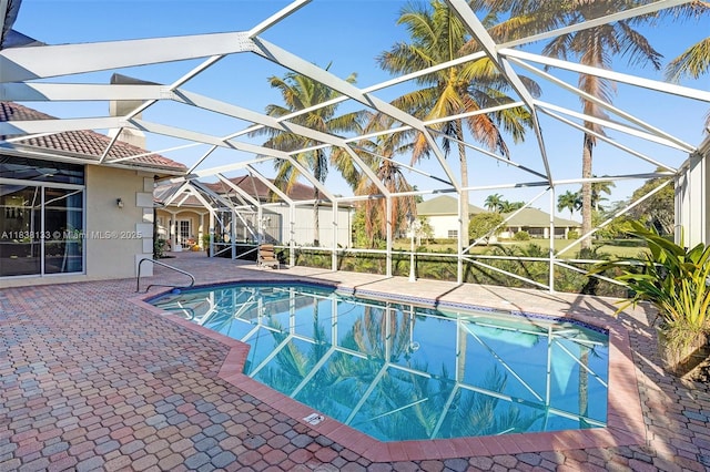 15595 Chandelle Pl, Wellington, FL 33414 - outdoor pool featuring a lanai and a patio area