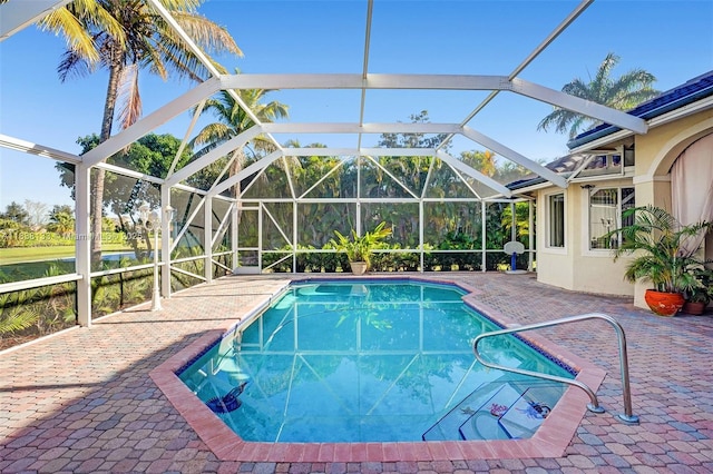 15595 Chandelle Pl, Wellington, FL 33414 - swimming pool featuring a patio and glass enclosure